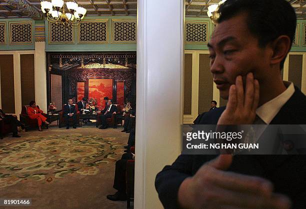 Chinese security personnel looks on as Mexico's President Felipe Calderon meets with Chinese Premier Wen Jiabao at the Zhongnanhai compound in...