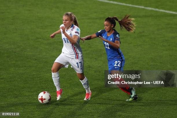 Agla Maria Albertsdottir of Iceland gets away from Sakina Karchaoui of France during the UEFA Women's Euro 2017 Group C match between France and...