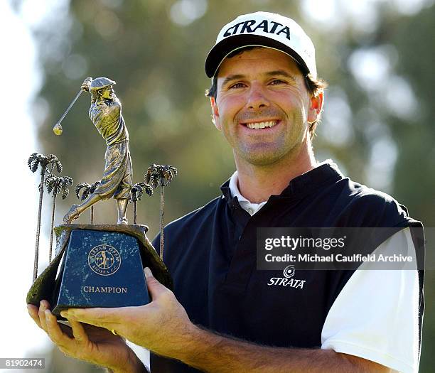 Len Mattiace holds his trophy after winning the Nissan Open.