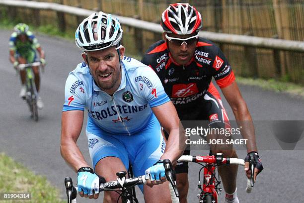 German Stefan Schumacher rides, on July 11 during the 159 km seventh stage of the 2008 Tour de France cycling race run between Brioude and Aurillac....