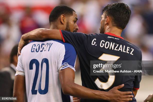 Dejected Aníbal Godoy of Panama is consolidated by Giancarlo Gonzalez of Costa Rica after losing 1-0 and being knocked out of the tournament during...