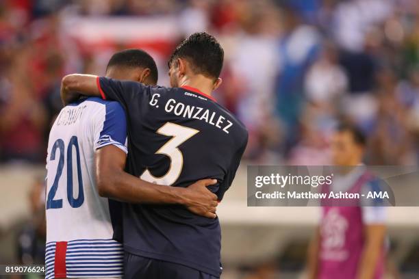 Dejected Aníbal Godoy of Panama is consolidated by Giancarlo Gonzalez of Costa Rica after losing 1-0 and being knocked out of the tournament during...