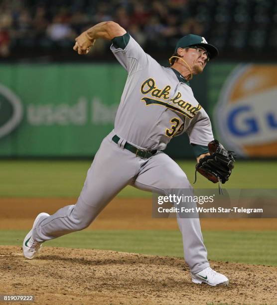 Relief pitcher Tyler Clippard, then of the Oakland Athletics, throws in the ninth inning against the Texas Rangers at Globe Life Park in Arlington,...