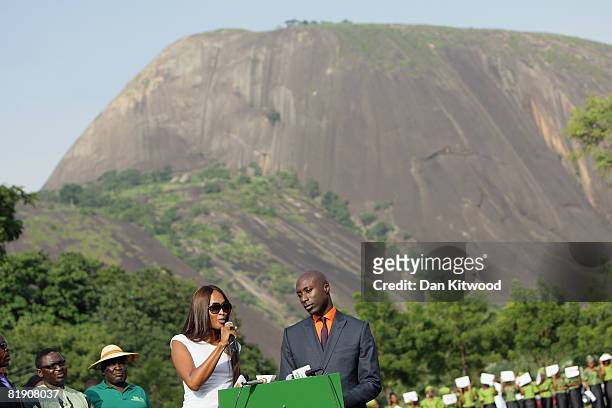Super model Naomi Campbell and British fashion designer Oswald Boateng give a speech before planting a Cocoa Tree in Abuja Central Park and Botanical...