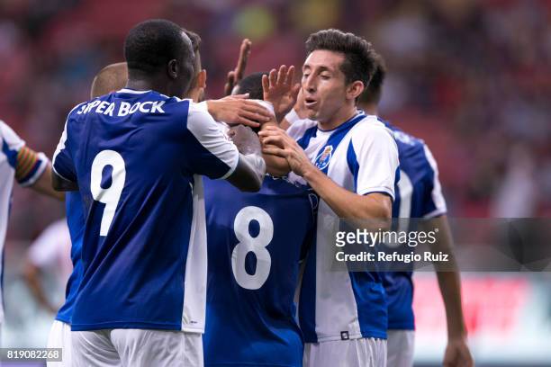 Otavio Monteiro of Porto celebrates with teammates after scoring the second goal of his team during the friendly match between Chivas and Porto at...