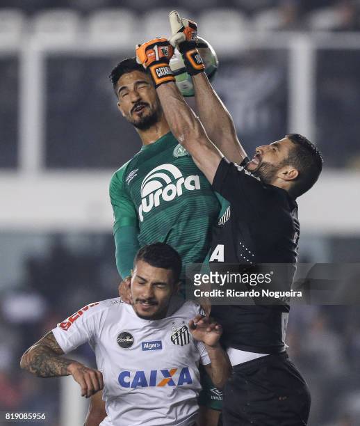 Vanderlei and Alison 5# of Santos battle for the ball with Lourency of Chapecoense during the match between Santos and Chapecoense as a part of...