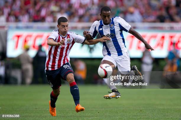 Ivan Gutierrez of Chivas fights for the ball with Galeno of Porto during the friendly match between Chivas and Porto at Chivas Stadium on July 19,...