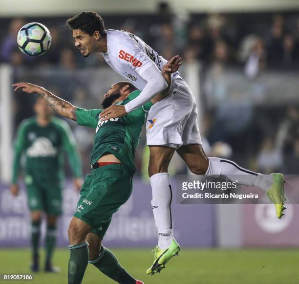 Lucas Verissimo of Santos battles for the ball with Fabricio Bruno of Chapecoense during the match between Santos and Chapecoense as a part of...