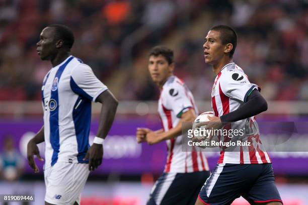 Juan Jose Macias of Chivas holds the ball after scoring the first goal of his team during the friendly match between Chivas and Porto at Chivas...