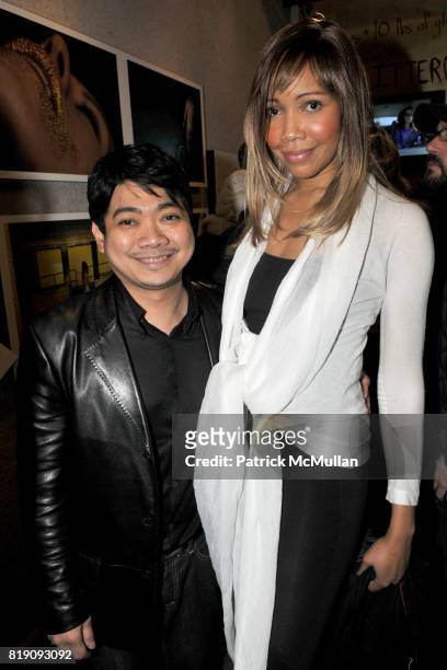 John Dabu and Tia Walker attend GLITTEROUS Opening Reception Hosted by THE SHALTZES and ZACH HYMAN at Chair and the Maiden Gallery on March 23, 2010...
