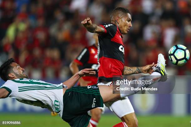 Paolo Guerrero of Flamengo struggles for the ball with Luan Garcia of Palmeiras during a match between Flamengo and Palmeiras as part of Brasileirao...