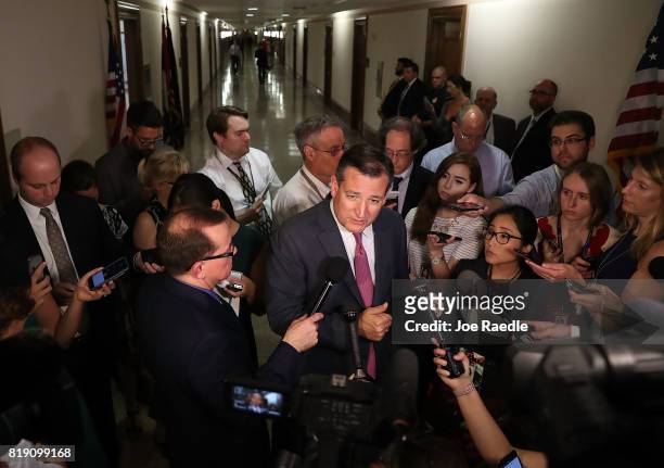 Sen. Ted Cruz speaks to reporters after attending a healthcare bill meeting with fellow Republican senators at the Dirksen Senate Office Building on...