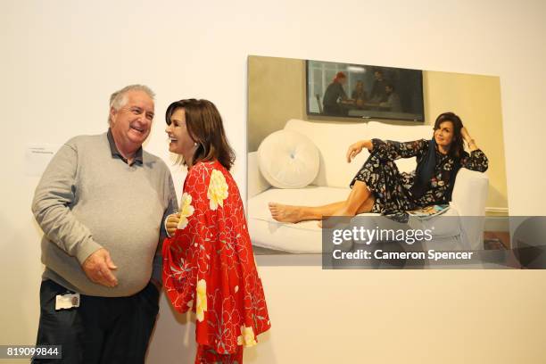 Lisa Wilkinson talks to Art Gallery of New South Wales Head Packer, Steve Peters in front of a portrait of her by artist, Peter Smeeth after it was...