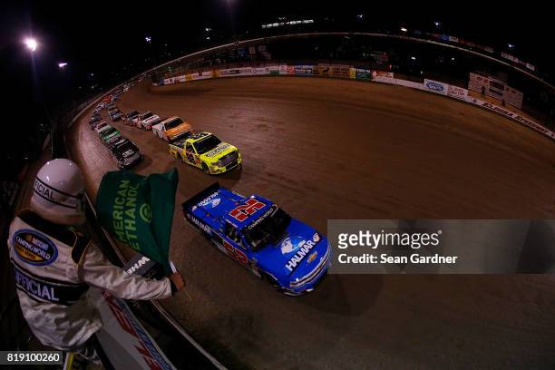 Stewart Friesen, driver of the Halmar International Chevrolet, leads the field during the start of the NASCAR Camping World Truck Series 5th Annual...