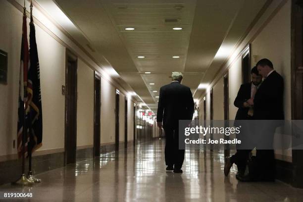 Sen. John Hoeven walks away after attending a healthcare bill meeting with fellow Republican senators at the Dirksen Senate Office Building on July...