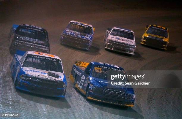 Johnny Sauter, driver of the Allegiant Airlines Chevrolet, battles Chase Briscoe, driver of the Cooper Standard Ford, as the lead a pack of trucks...