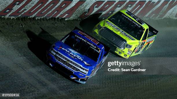 Stewart Friesen, driver of the Halmar International Chevrolet, leads Matt Crafton, driver of the Ideal Door/Menards Toyota, during the NASCAR Camping...