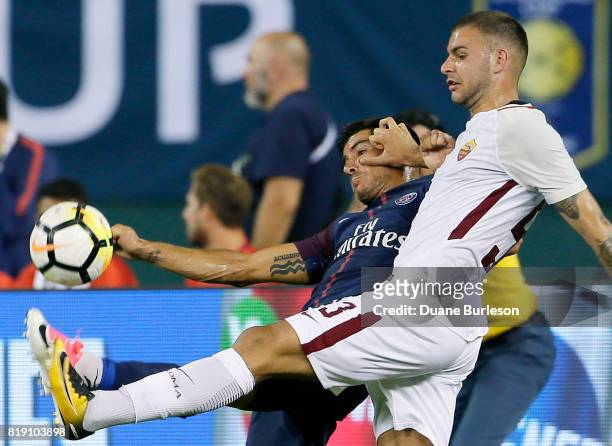 Marco Tumminello of AS Roma pushes off on Yuri Berchiche of Paris Saint-Germain while going after the ball during the second half at Comerica Park on...