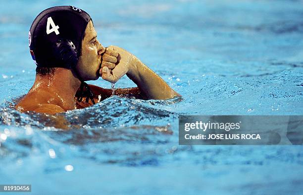 Vanja Udovicic of Serbia celebrates a goal during the semifinal match against Hungary in the aquatic center swimming pool of Malaga on July 11, 2008...