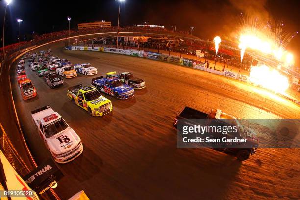 The field does a 4 wide parade lap before the start of the NASCAR Camping World Truck Series 5th Annual Dirt Derby 150 at Eldora Speedway on July 19,...