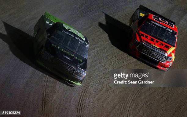 Austin Cendric, driver of the Fitzgerald Glider Kits Ford, leads Cody Coughlin, driver of the Ride TV/JEGS Toyota, during the NASCAR Camping World...