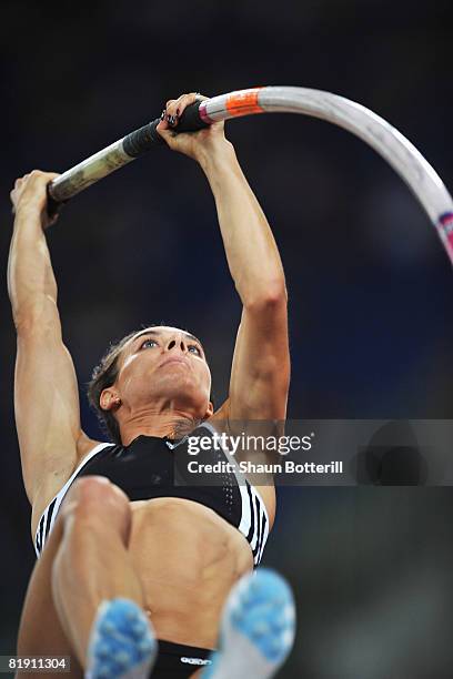 Yelena Isinbaeva of Russia competes on her way to setting a new world record of 5.03m in the Womens Pole Vault during the IAAF Golden Gala at the...