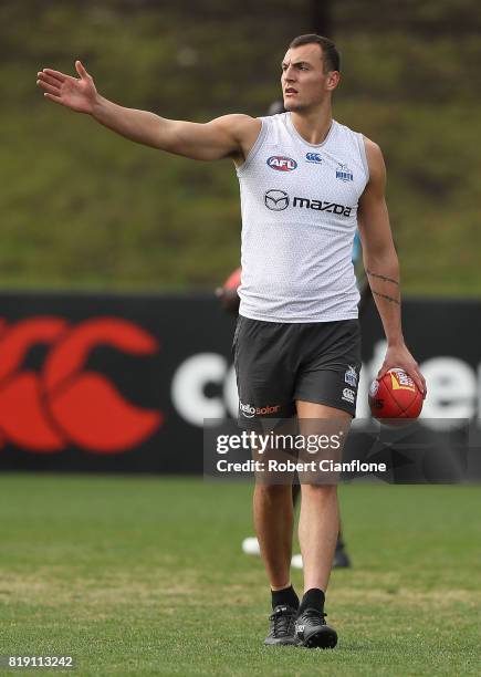 Braydon Preuss of the Kangaroos getures during a North Melbourne Kangaroos AFL training session at Arden Street Ground on July 20, 2017 in Melbourne,...