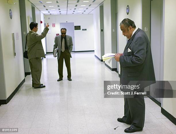 May 31: House Ways and Means Chairman Charles B. Rangel, D-N.Y., rights, waits for the elevator as he leaves his district office in the Adam Clayton...