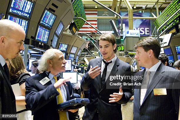 Broker Peter Tuchman shows actor Josh Hartnett and director Austin Chick how to make trades on the floor of the New York Stock Exchange on July 11,...