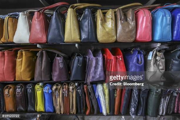 Bags sit on display at the Shakra Leather Arts store in the Dharavi area of Mumbai, India, on Tuesday, July 18, 2017. India's new goods and services...