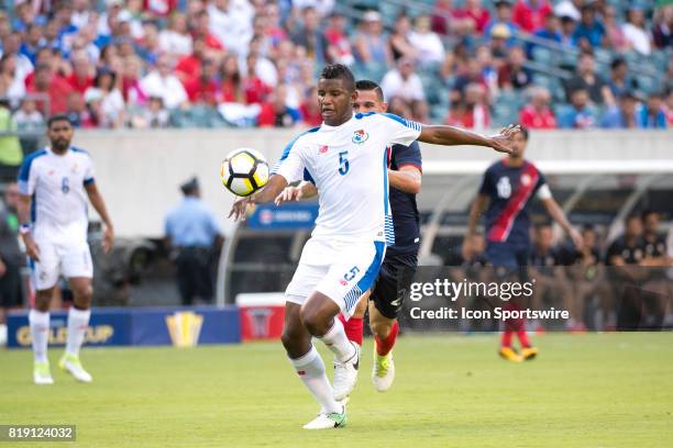 Panama Defender Fidel Escobar keeps the ball away from Costa Rica Midfielder David Guzmán in the first half during the CONCACAF Gold Cup Quarterfinal...