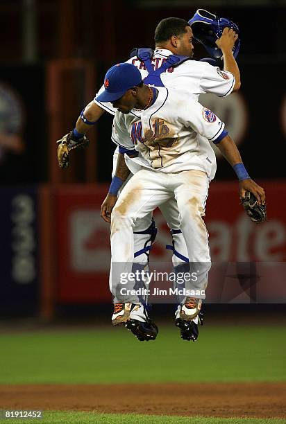 Jose Reyes and Ramon Castro of the New York Mets celebrate their 2-1 victory agaianst the Colorado Rockies on July 11, 2008 at Shea Stadium in the...