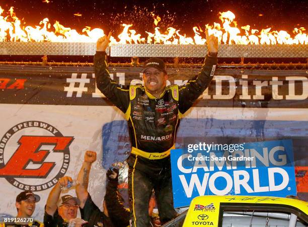 Matt Crafton, driver of the Ideal Door/Menards Toyota, celebrates after winning the NASCAR Camping World Truck Series 5th Annual Dirt Derby 150 at...