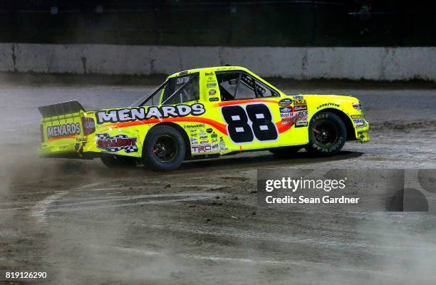 Matt Crafton, driver of the Ideal Door/Menards Toyota, celebrates after winning the NASCAR Camping World Truck Series 5th Annual Dirt Derby 150 at...