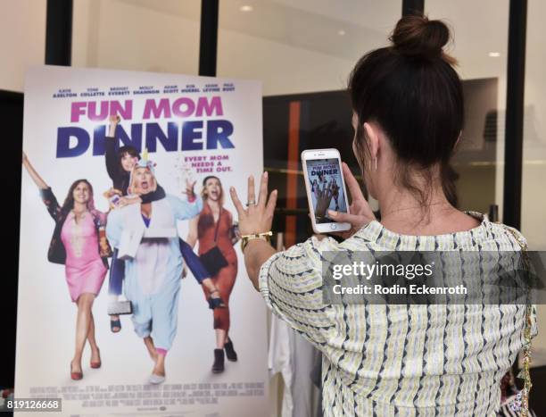 Actress Kate Aselton takes video at the release party for "Fun Mom Dinner" at Clare V. On July 19, 2017 in West Hollywood, California.