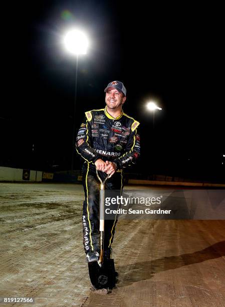 Matt Crafton, driver of the Ideal Door/Menards Toyota, digs up dirt form the track after winning the NASCAR Camping World Truck Series 5th Annual...