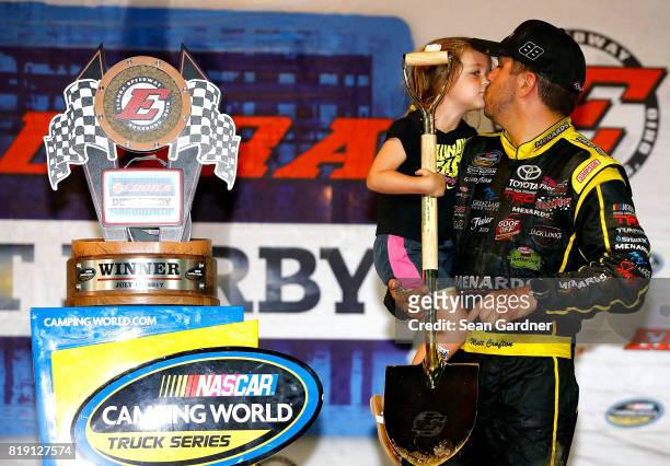 Matt Crafton, driver of the Ideal Door/Menards Toyota, celebrates with his daughter Elladee Crafton after winning the NASCAR Camping World Truck...