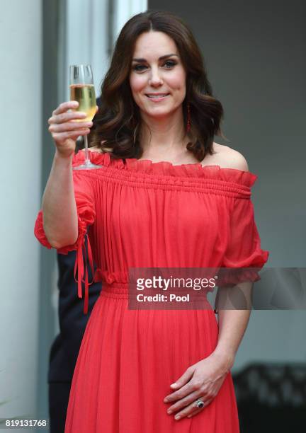 Catherine, Duchess of Cambridge attends takes part in a toast The Queen's Birthday Party at the British Ambassadorial Residenceduring an official...