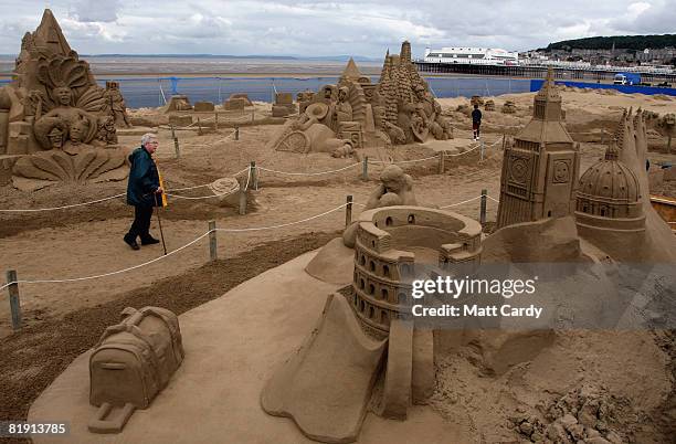 People stop to look at the sand sculptures at the Sand Sculpture Festival as it opens to the public on July 12 2008 in Weston Super Mare, England....