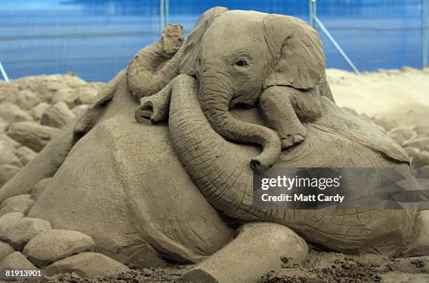 Sand sculptures are displayed at the Sand Sculpture Festival as it opens to the public on July 12 2008 in Weston Super Mare, England. Sand artists...