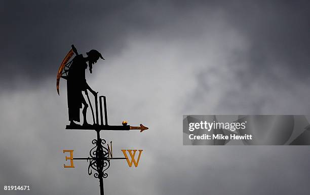 The Old Father Time weather vane is pictured during day three of the First Test match between England and South Africa at Lord's Cricket Ground on...