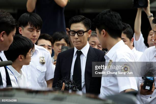 Of South Korean boyband Big Bang leaves after attending a verdict hearing at the Seoul Central District Court on his marijuana usage case on July 20,...