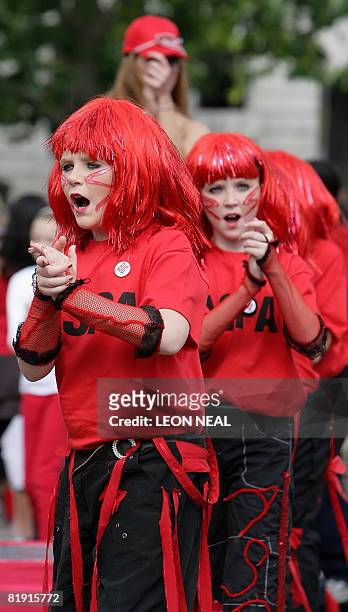 People dance as 2008 people, dressed in red, yellow and blue participated in the world's largest dance, The Big Dance, a specially commissioned new...