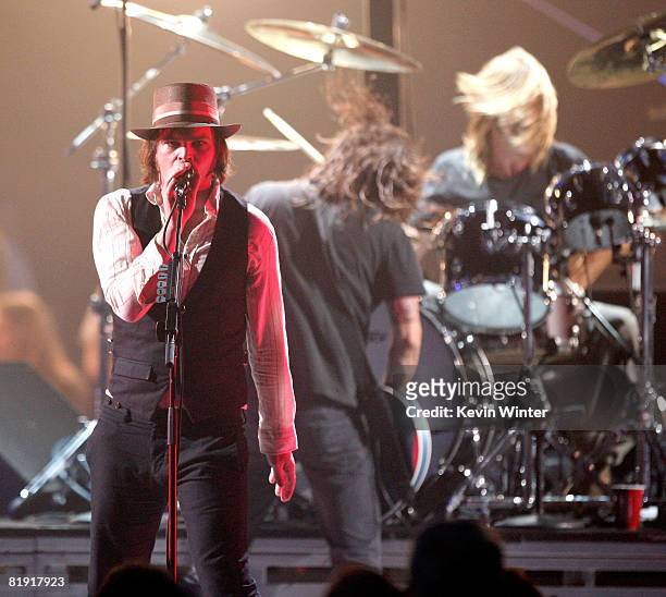 Musician Gaz Coombes of "Supergrass" performs with Dave Grohl and Taylor Hawkins of "Foo Fighters" onstage during the 3rd Annual VH1 Rock Honors at...