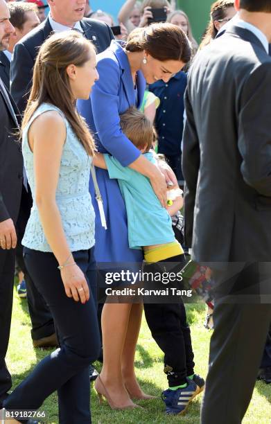 Catherine, Duchess of Cambridge gets hug as she visits Strassenkinder, a charity which supports young people from disadvantaged backgrounds and also...