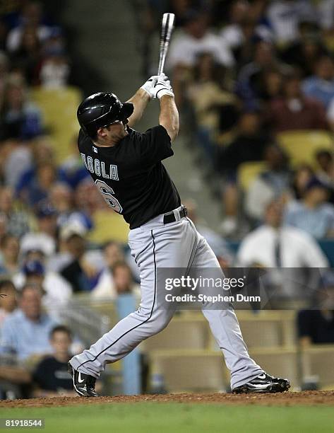 Dan Uggla of the Florida Marlins doubles in the go ahead run in the 11th inning against the Los Angeles Dodgers on July 12, 2008 at Dodger Stadiium...