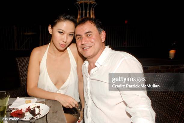 Micca Wang and Nouriel Roubini attend Denise and Daniella Rich host a Summer Cocktail to benefit Gabrielle's Angel Foundation for Cancer Research at...