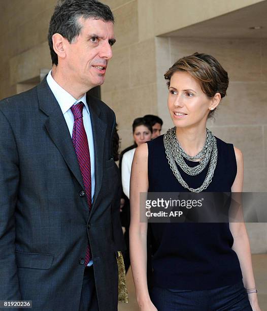 Syrian President Bashar al-Assad's wife Asma al-Assad speaks with the Louvre Museum's President Henri Loyrette as she visits the Louvre on July 13,...