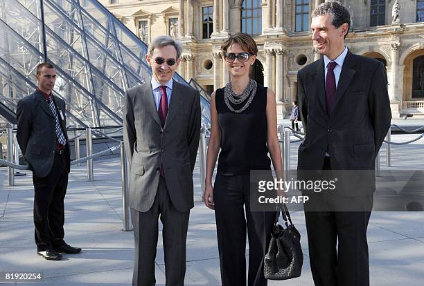 Syrian President Bashar al-Assad's wife Asma al-Assad is welcomed by the Louvre Museum's President Henri Loyrette and the France's ambassador to...
