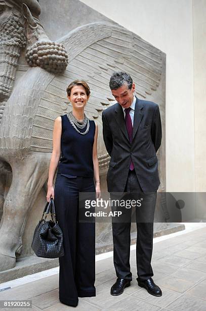 Syrian President Bashar al-Assad's wife Asma al-Assad poses with the Louvre Museum's President Henri Loyrette as she visits the Louvre on July 13,...